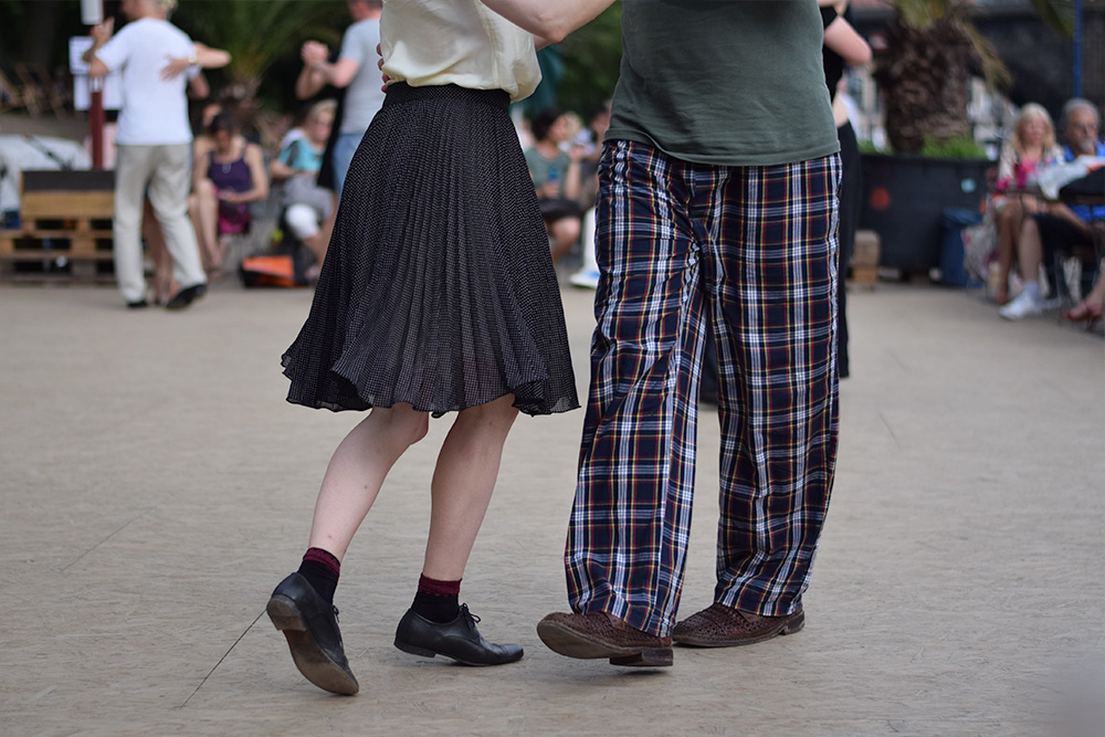 Photo of couple dancing along the River Spree in Berlin, Germany.