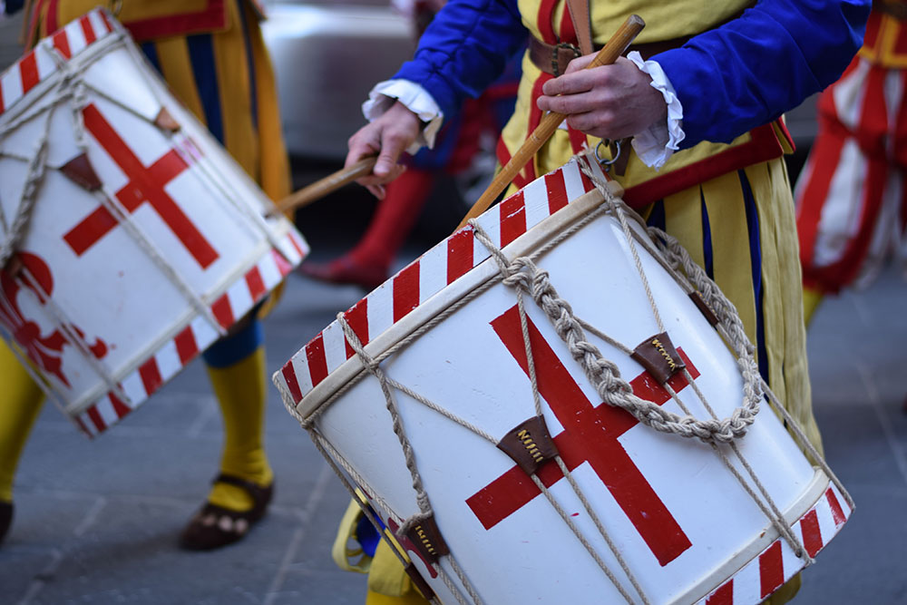 A photo of two drummers in period costume during an Easter celebration in Florence, Italy