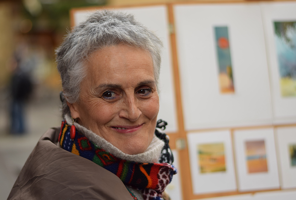 A photo of an artist, a beautiful woman smiling, in Florence, Italy