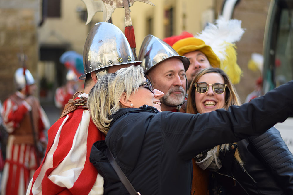 A photo of a group of friends posing for a 'selfie' during an Easter celebration in Florence, Italy