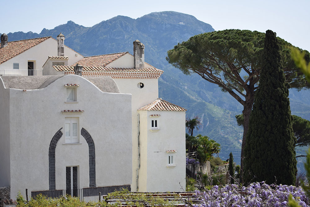 Photo of a beautiful building surrounded by trees in Ravello, Italy.