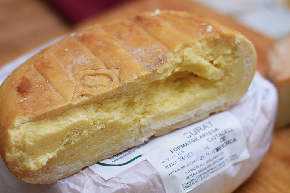 Photograph of Menorcan cheese at the Santa Maria market in Mallorca, Spain.