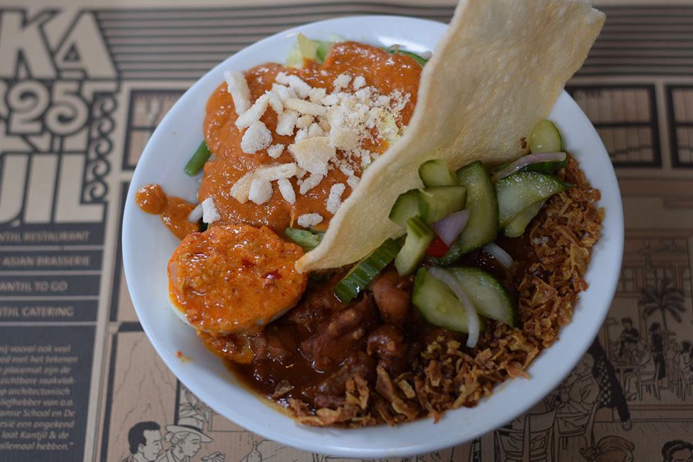 A photo of a colorful bowl of Indonesian food at an Indonesian restaurant.