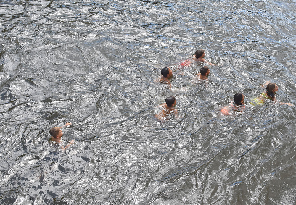 Photo of children swimming in the Dordogne River near Beynac, France.